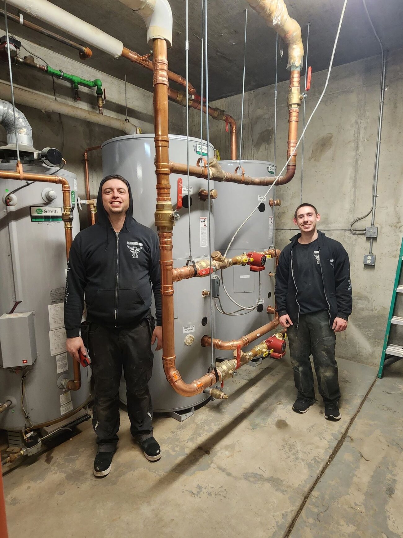 Morley and Joey Drake at a Plumber MD commercial copper water-heater install