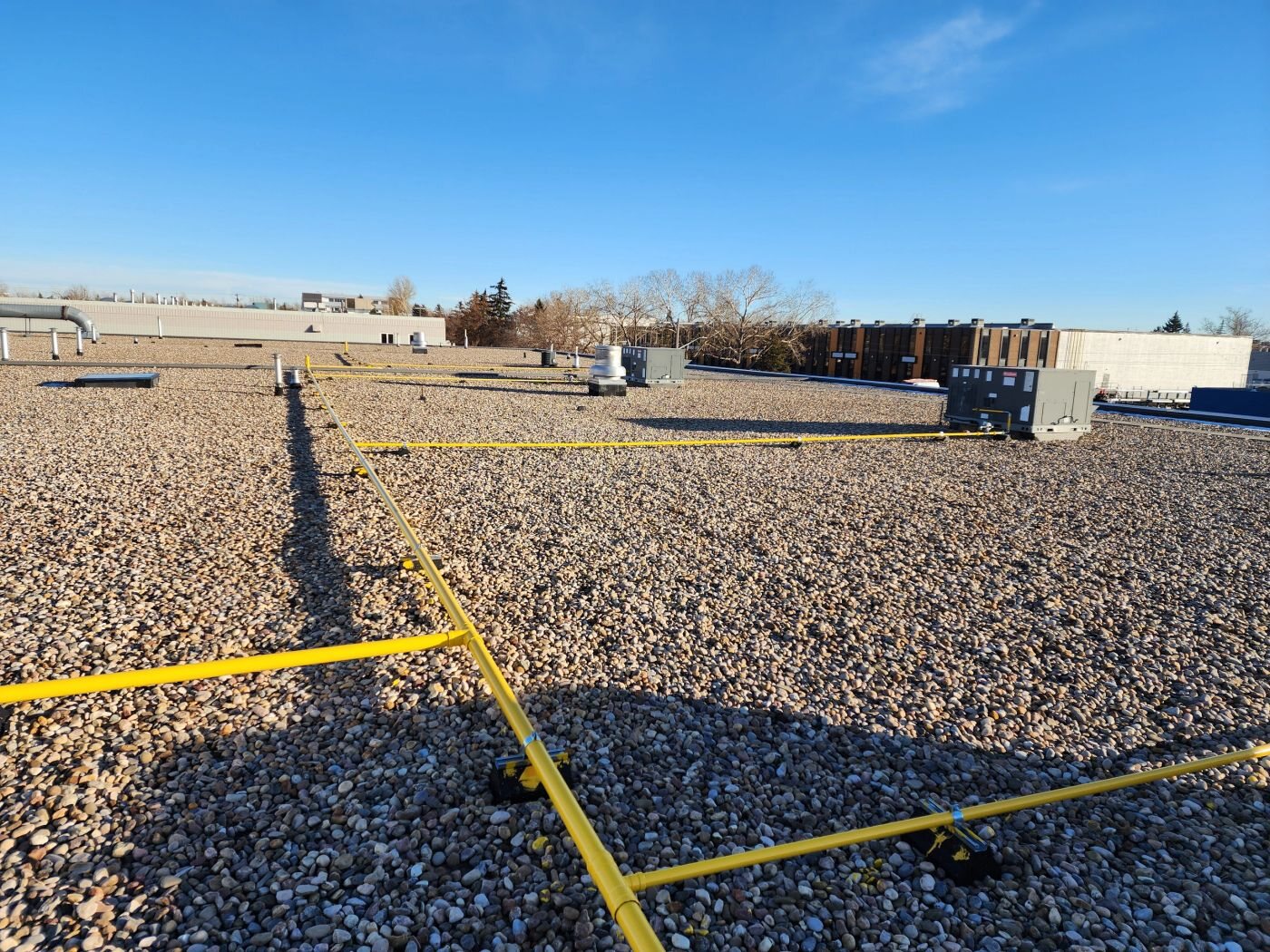 Plumber MD commercial gas-line work on a Calgary rooftop